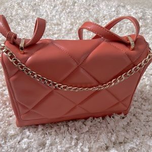 Coral purse with Gold embellishments. Can be worn as shoulder bag or hand bag.